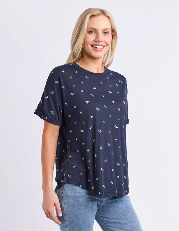Model wearing Navy Festive Market Tee By Elm Available at Beetees Nelson