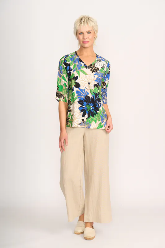Model wearing Floral Delight Pintuck Scoop Hem Top By Foil Available at Beetees Nelson