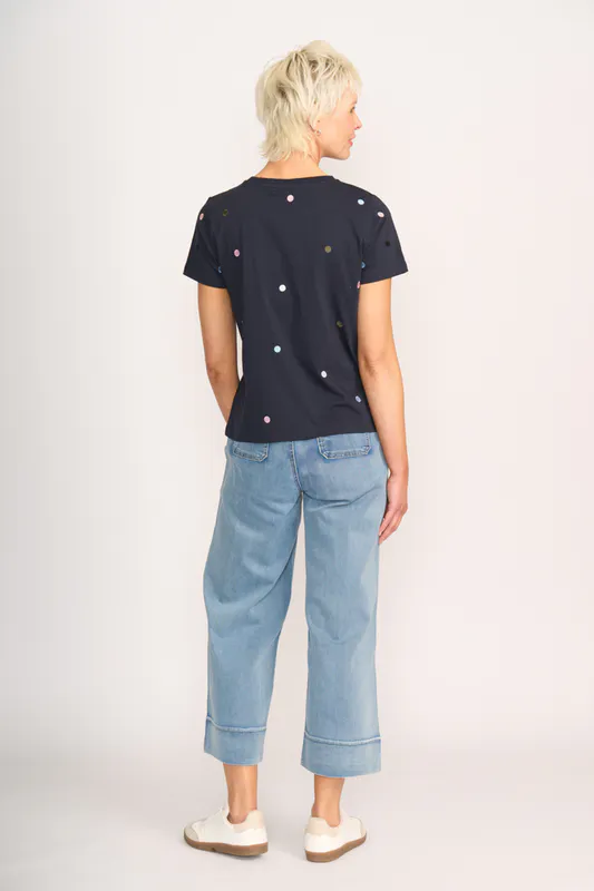 Model wearing Navy Spot T-Shirt- Embroidery By Memo Available at Beetees Nelson