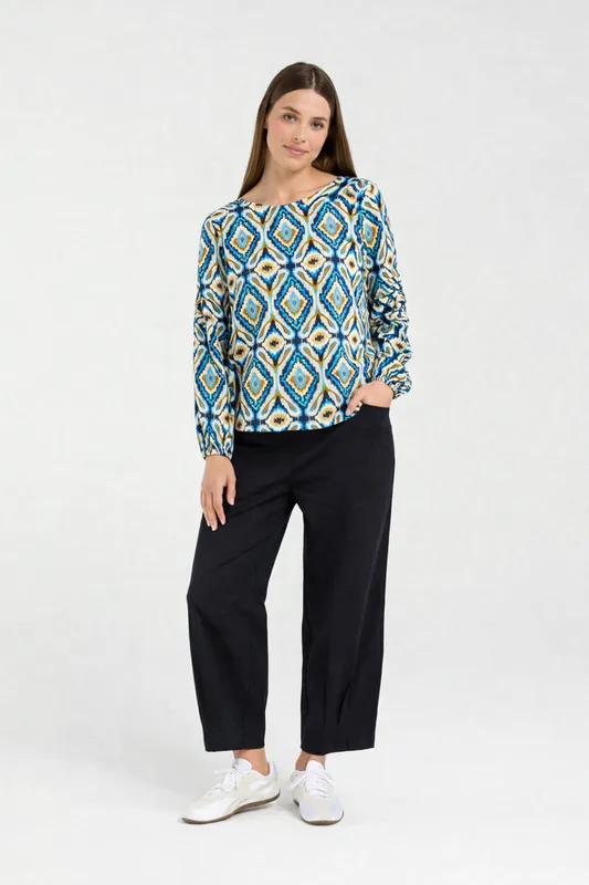 Model wearing Regatta Blue Aztec Skylar Pintuck Sleeve Top By Blackstone Available at Beetees Nelson