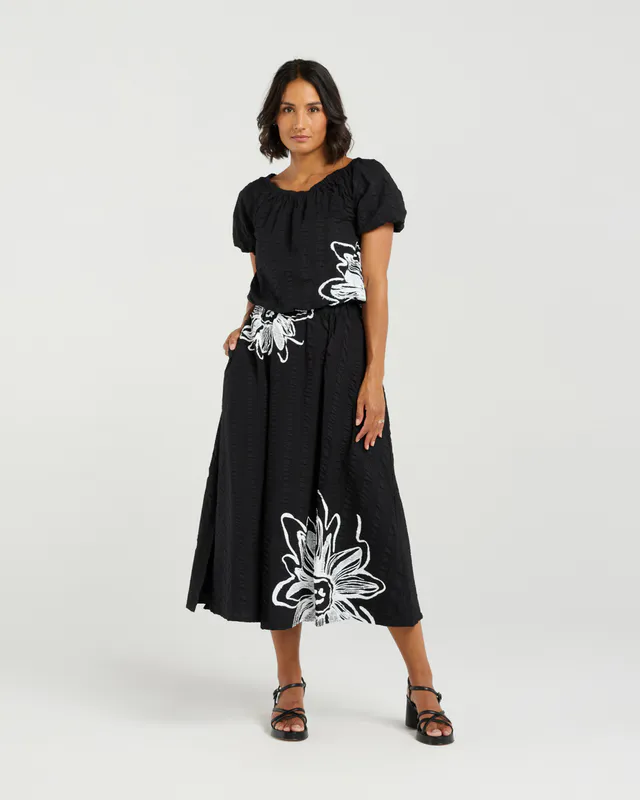 Model wearing Black Bloom Daisy Crop By Et Alia Available at Beetees Nelson