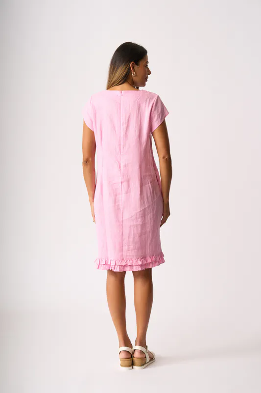 Model wearing Pink Ruffle Dreams Dress By Foil Available at Beetees Nelson