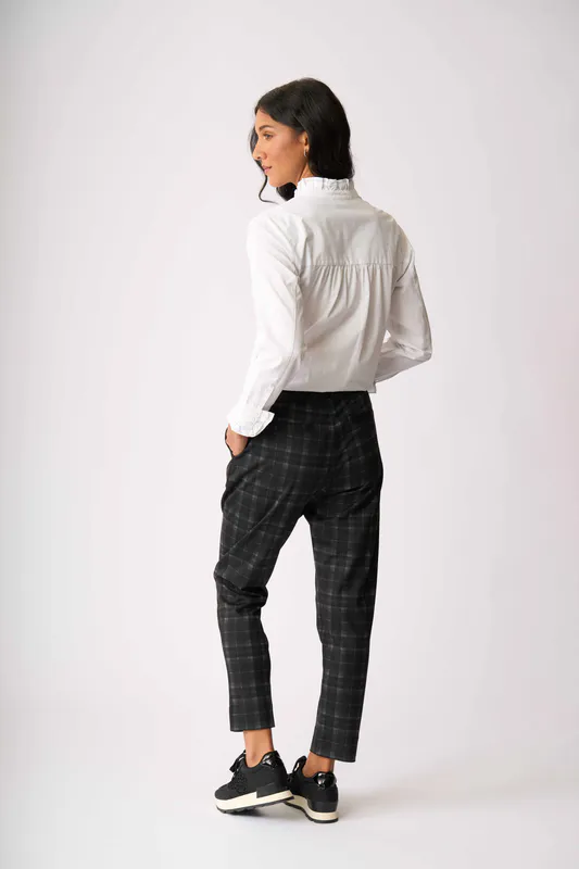 Model wearing Shadow Check Adjustable Cuff Trousers By Esplanade Available at Beetees Nelson
