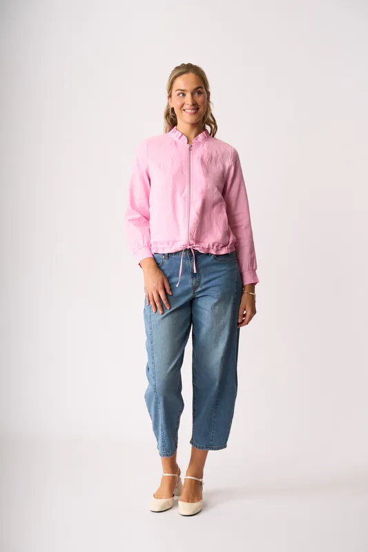 Model wearing Pink Ruffle Neck Jacket By Foil Available at Beetees Nelson