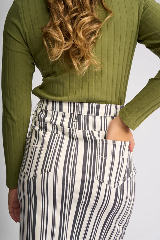 Model wearing Multi Stripe Denim Poppy Skirt By Vassalli Available at Beetees Nelson