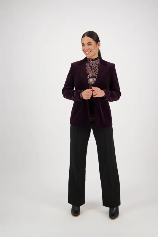 Model wearing Mulberry Coloured Shaped Lined Cord Blazer with Back Vent and Button Cuff Detail By Vassalli Available at Beetees Nelson