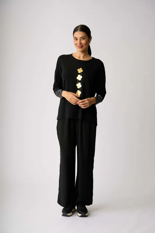 Model wearing Lucky Clover Blocked Stripe Top By Foil Available at Beetees Nelson