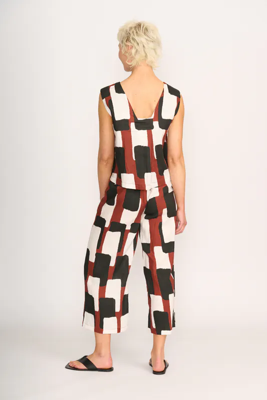 Model wearing Spice Box Top - Sleeveless, Pleat Back By Foil Available at Beetees Nelson