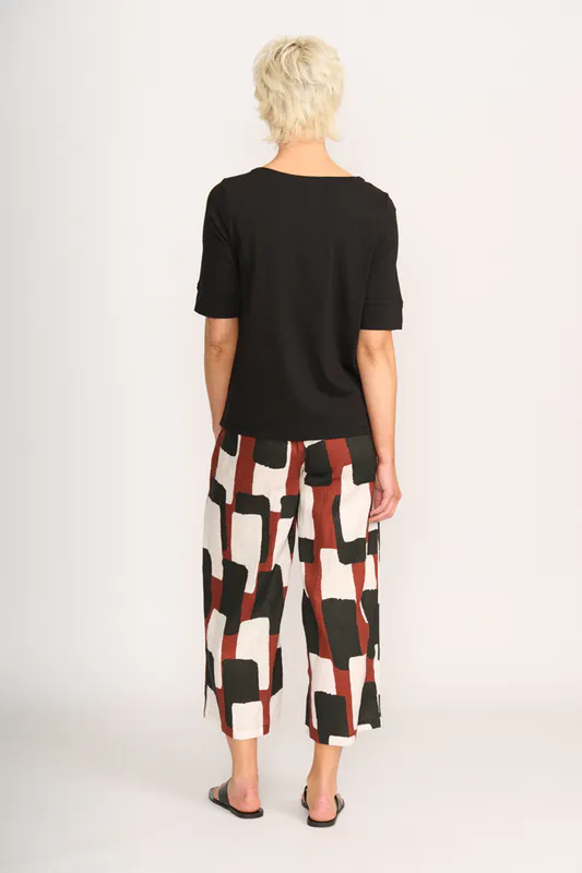 Model wearing Black Tee - Wide Neck, Elbow Sleeve By Esplanade Available at Beetees Nelson