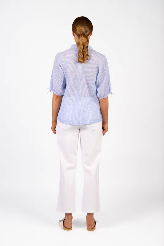 Model wearing Spin Jean Link Shirt By Knewe Available at Beetees Nelson