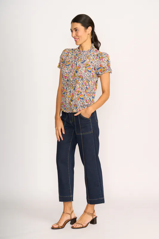 Model wearing Denim Floral Ultimate Crush Cap Sleeve Shirt By Foil Available at Beetees Nelson