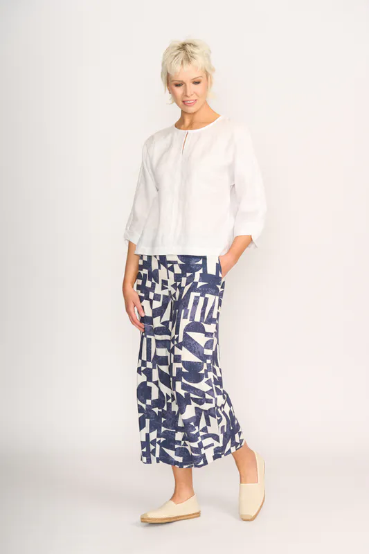 Model wearing White Plot Twist Top By Foil Available at Beetees Nelson