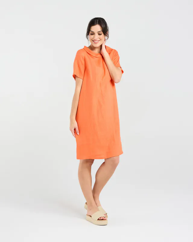 Model wearing Sunset Orange Natacha Linen Button Back Dress By Blackstone Available at Beetees Nelson