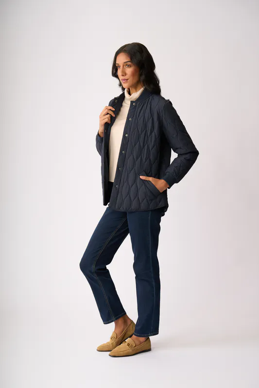 Model wearing Midnight Quilted Snap Jacket By Foil Available at Beetees Nelson