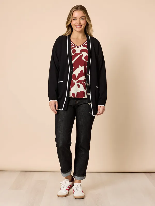 Model wearing Black Slalom Heart Cardi By Threadz Available at Beetees Nelson