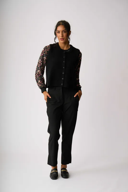 Model wearing Black Rib Button Front Vest By Oh Three Available at Beetees Nelson