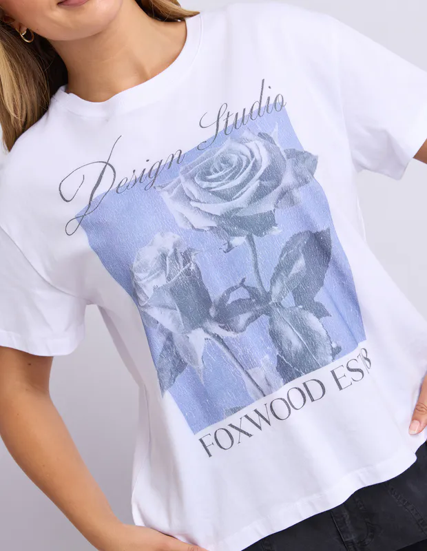 Model wearing Cornflower Blue Studio Rose Tee By Foxwood Available at Beetees Nelson