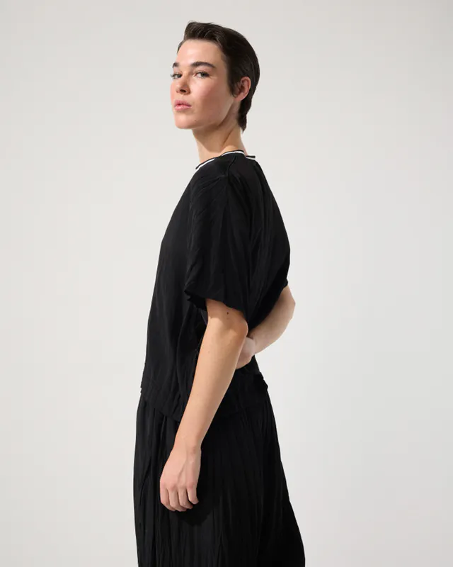 Model wearing Black Crushed Travel Top By Marco Polo Available at Beetees Nelson