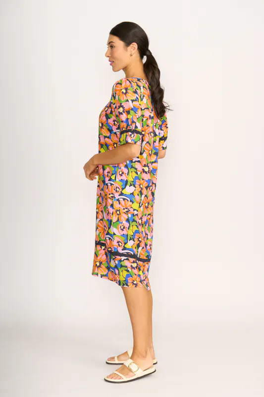 Model wearing Summer Burst Trim Time Dress By Foil Available at Beetees Nelson