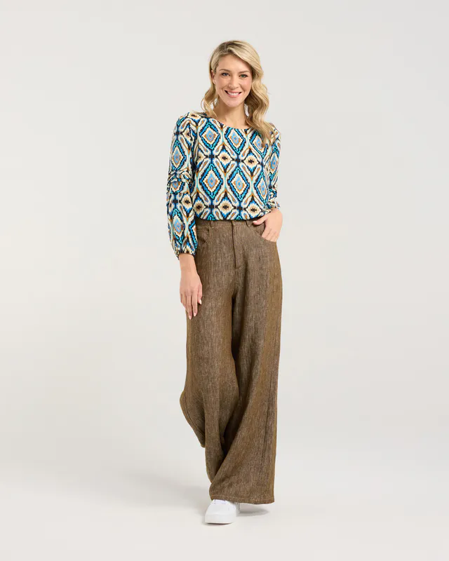 Model wearing Regatta Blue Aztec Skylar Pintuck Sleeve Top By Blackstone Available at Beetees Nelson