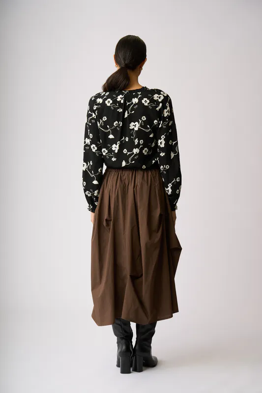 Model wearing Mono Floral Elasticated Cuff Blouse By Foil Available at Beetees Nelson