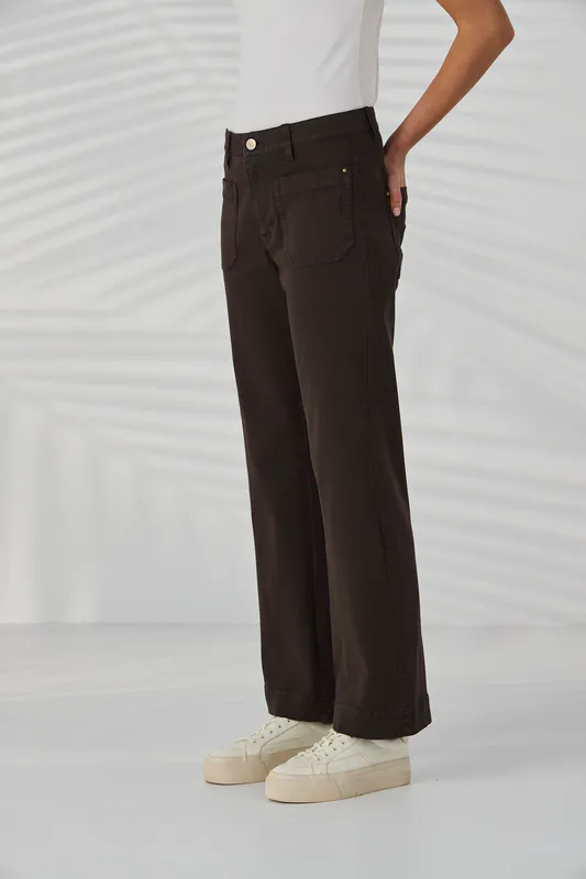 Model wearing Cocoa Chrome Jean By Lania Available at Beetees Nelson