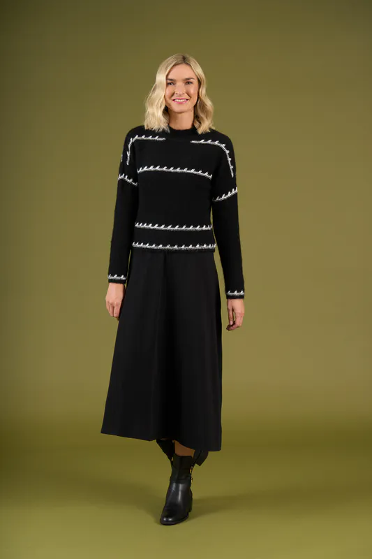 Model wearing Mono Stripe Mackenzie Knit By Charlie Jane Available at Beetees Nelson