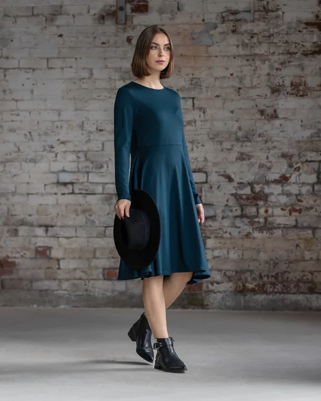 Model wearing Dragonfly Lotus Merino Dress By Vassalli Available at Beetees Nelson