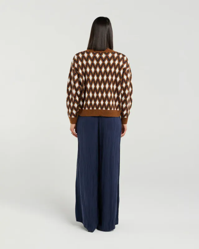 Model wearing Ink Argyle Tilda Jumper By Et Alia Available at Beetees Nelson