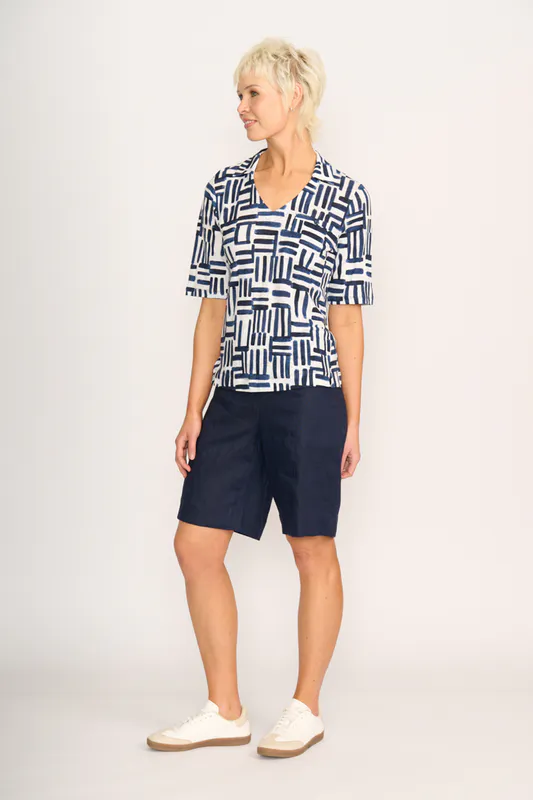 Model wearing Block & Roll Team Player Top By Foil Available at Beetees Nelson