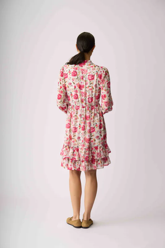 Model wearing Feminine Floral Tier It Up Dress By Memo Available at Beetees Nelson