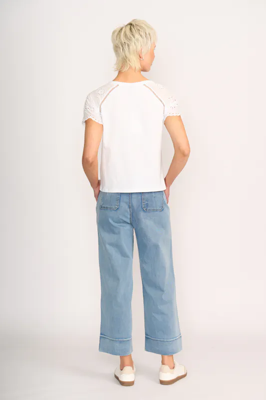 Model wearing White T-Shirt - Broderie Sleeve By Memo Available at Beetees Nelson