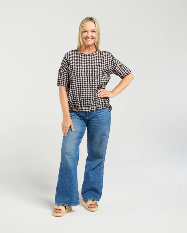 Model wearing Black Check Nikita Top By Seduce Available at Beetees Nelson