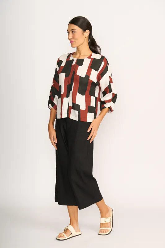 Model wearing Spice Box Plot Twist Top By Foil Available at Beetees Nelson