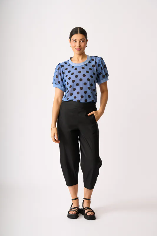 Model wearing Black Barrel Along Trousers By Oh Three Available at Beetees Nelson