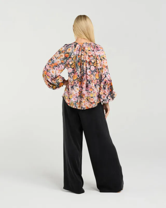 Model wearing Monet's Garden Phoebe Gathered Sleeve Top By Blackstone Available at Beetees Nelson