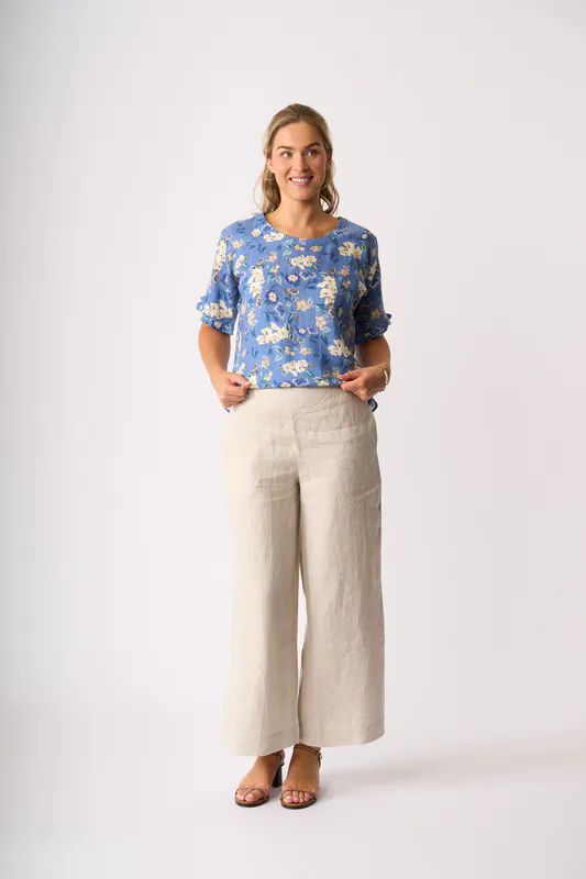 Model wearing Denim Delight Ruffles & Scoop Hem Top By Foil Available at Beetees Nelson