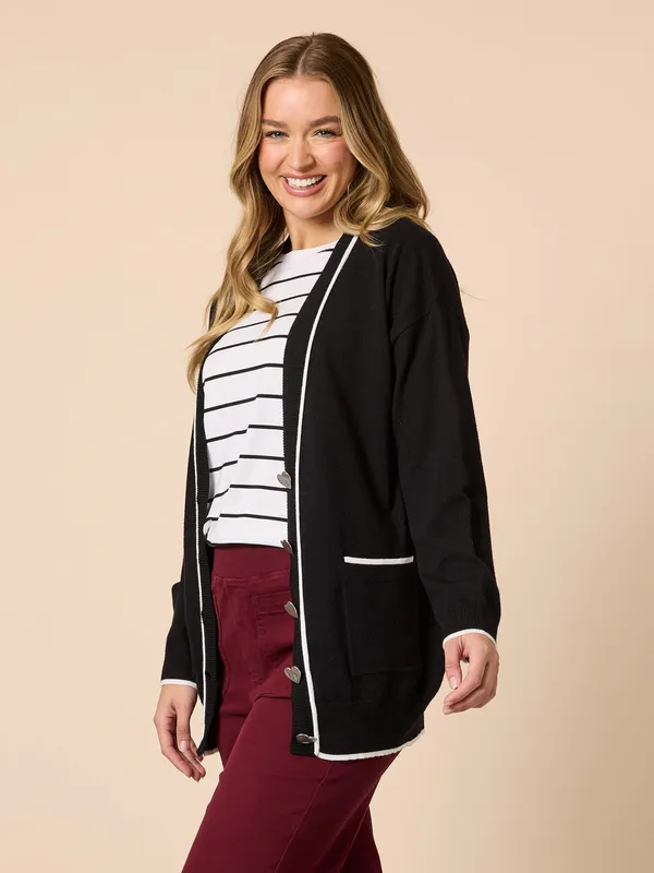 Model wearing Black Slalom Heart Cardi By Threadz Available at Beetees Nelson