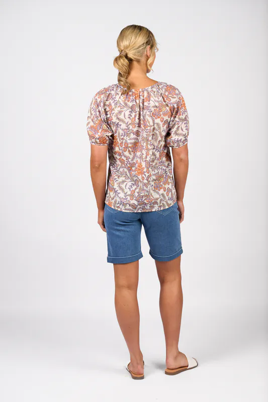 Model wearing Tuscany Printed V Neck Top with Floaty Sleeve By Vassalli Available at Beetees Nelson