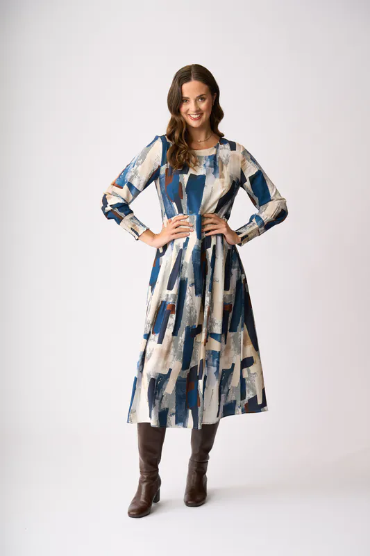 Model wearing Modern Art Pleats Please Dress By Preen Available at Beetees Nelson