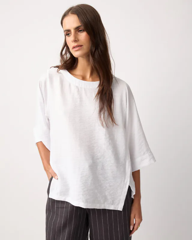 Model wearing White Skye Top By Yarra Trail Available at Beetees Nelson
