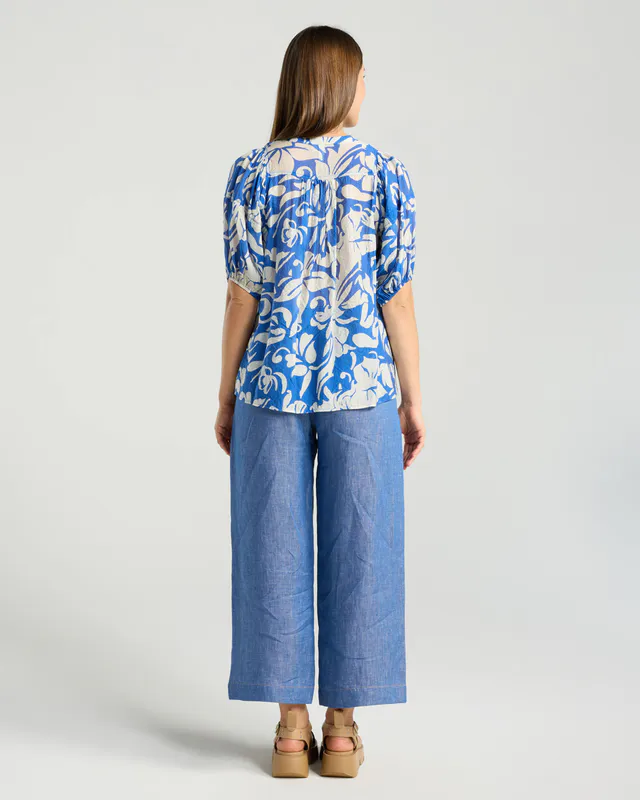 Model wearing Blue Ivory Floral Bridget Pintuck Top By Blackstone Available at Beetees Nelson