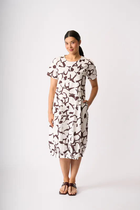 Model wearing Uspa- Daisy Pleated Maxi Dress By Foil Available at Beetees Nelson