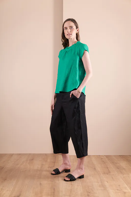 Model wearing Green Coloured TOP - SWING HEM, ROUCHED SHOULDER Available at Beetees Nelson