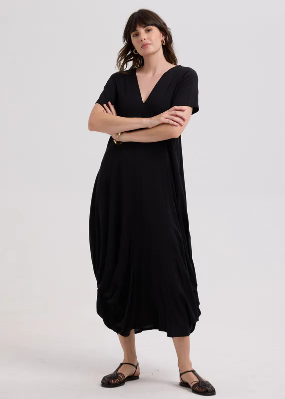 Model wearing Black Drape Bottom Dress By LD + CO Available at Beetees Nelson