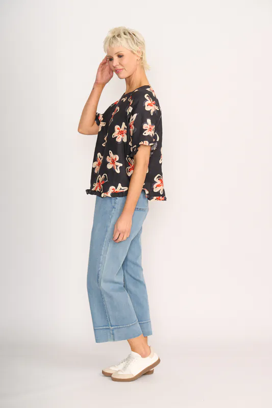 Model wearing Flower Doodle Top - Ruffles & Scoop Hem By Preen Available at Beetees Nelson