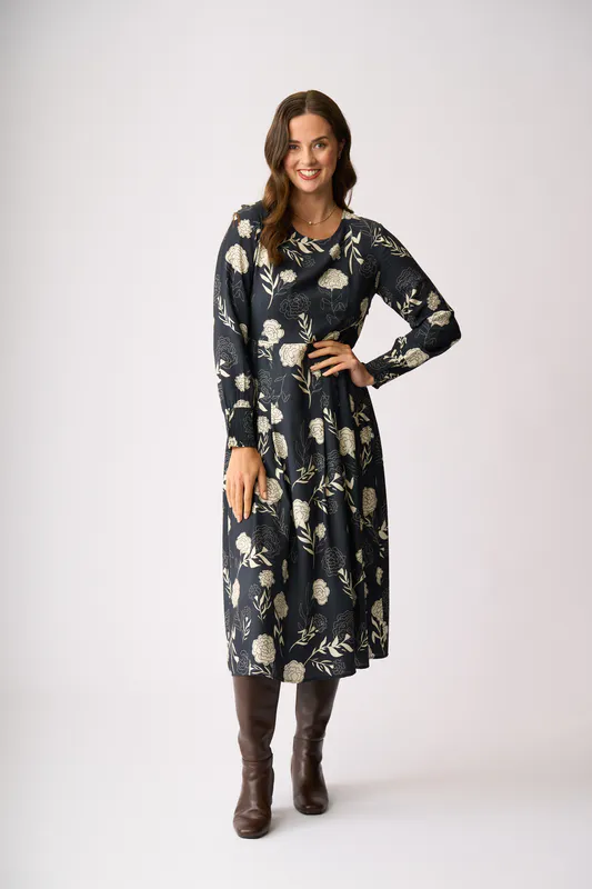 Model wearing Midnight Blooms Pleats Please Dress By Preen Available at Beetees Nelson