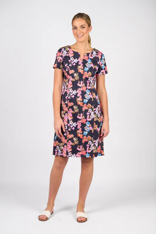 Model wearing Willa Printed Lightweight Fitted Dress with Short Sleeve By Vassalli Available at Beetees Nelson
