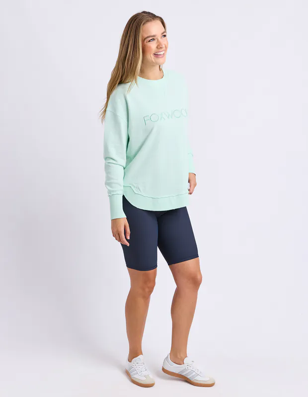 Model wearing Neon Blue Simplified Crew By Foxwood Available at Beetees Nelson