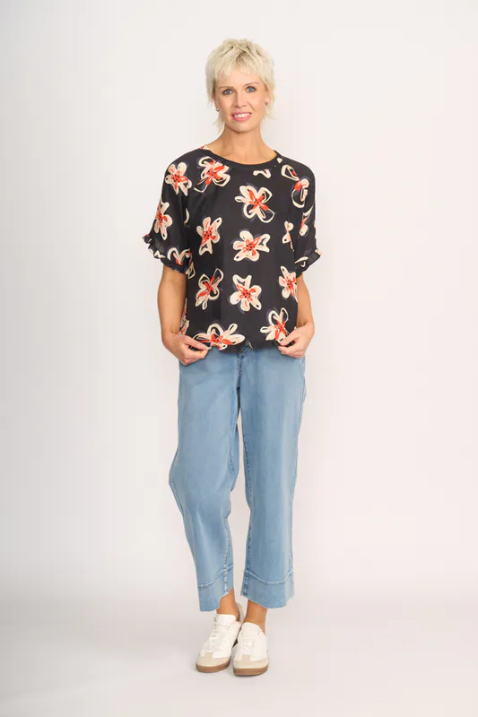 Model wearing Flower Doodle Top - Ruffles & Scoop Hem By Preen Available at Beetees Nelson